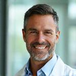 Headshot of Dr. Alex Johnson, a friendly and knowledgeable medical doctor dedicated to community health.